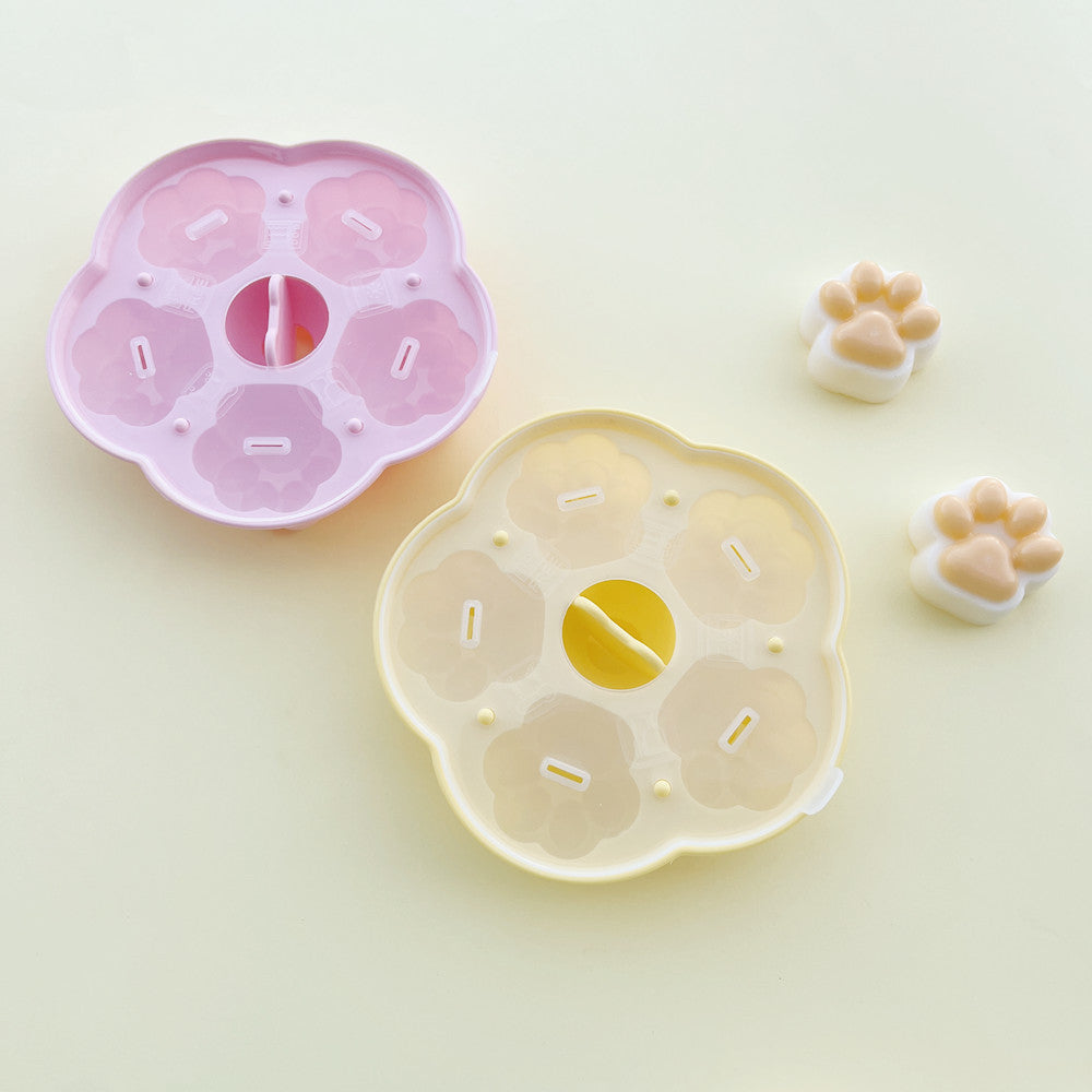 Cat paw silicone mold shown with finished shaped food